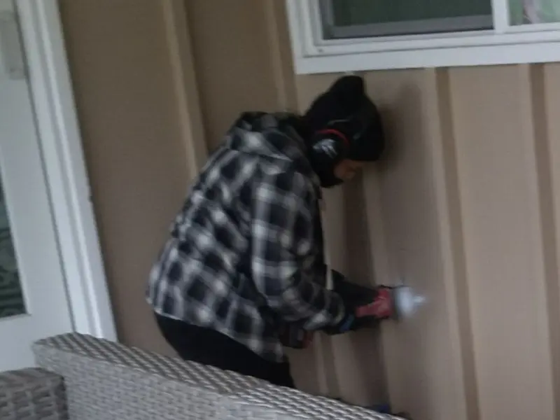Professional electrician installing an exterior outlet in Conway
